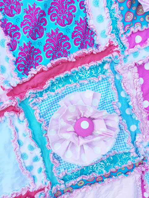 Close up of Ruffle Flowers on Crib Quilt for Baby Girl