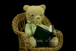 OOAK artist teddy bear sitting in a chair reading a book
