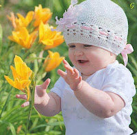 Cute Baby in White Dress With yellow flowers Images