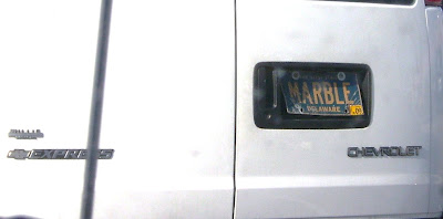 White van with a Delaware plate that says MARBLE on it