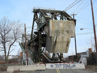 This photo from 2018 shows the South Front Street bridge in the open position, as it has been since 2011. Also shown are the concrete barricades that prevent passage to the bridge.