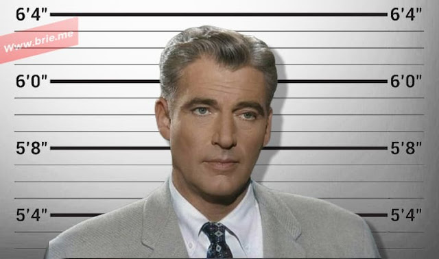 William Hopper standing in front of a height chart