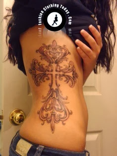 Tattoo for girls:Elaborate cross tattoo on side body