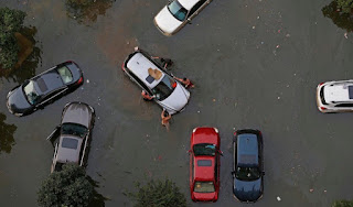 Vehicles are submerged in floodwaters on July 9, 2016 in Wuhan, Hubei Province of China. Many parts of the Wuhan area were submerged in floodwaters during July as torrential rains affected the Yangtze River valley. A new study finds that climate change increased the risk of the rains that led to the flooding by 17 – 59%. (Image credit: VCG/VCG via Getty Images) Click to Enlarge.