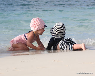ALT="Bahamas Family Photography, brother and sister playing at beach,  Exuma Bahamas"
