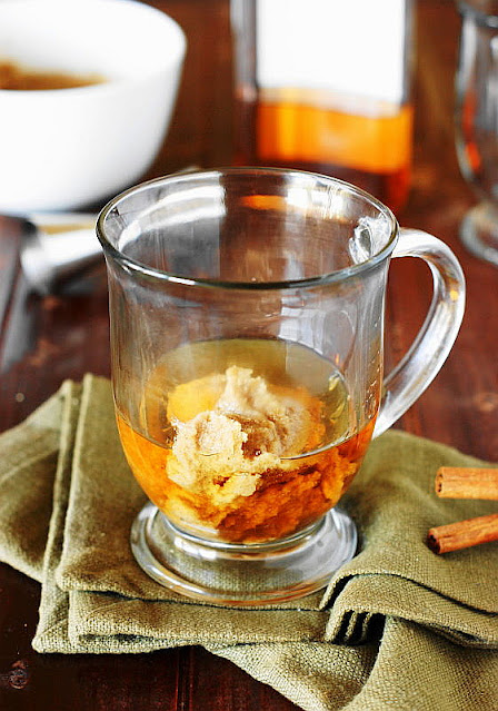 Hot Buttered Rum Batter and Rum in Bottom of a Glass Mug Image