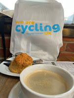 cycling uk bag, scone and coffee