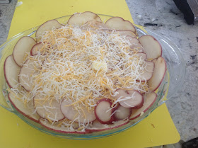 scalloped potatoes and shredded cheese 