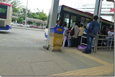 rushing to get onto the bus