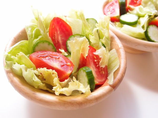 Image: A bowl of salad - a small bowl of salad with lettuce, cucumber and tomatoes. Photo Credit: Naomi Kuwashima, on Freeimages