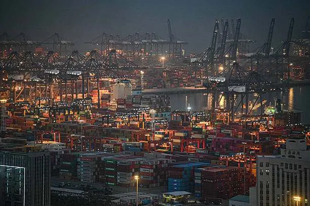 Shipping containers and gantry cranes are illuminated at night at Yantian Port in Shenzhen, Guangdong province, southern China, on April 14, 2025. Photo by Jade Gao/AFP