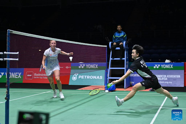 He Bingjiao (R) competes during the women's singles round of 32 match between He Bingjiao of China and Mia Blichfeldt of Denmark at the Malaysia Open badminton tournament 2024 in Kuala Lumpur, Malaysia, Jan. 10, 2024. (Photo by Chong Voon Chung/Xinhua)