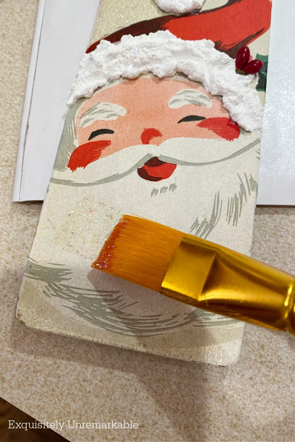 Adding Glitter To Decoupage Santa Face