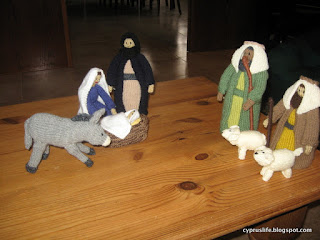 donkey, Mary, Joseph, baby, manger, two shepherds and lambs, all knitted