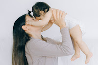 Baby reaching for mom