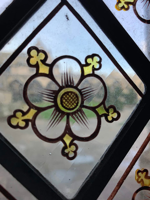 stained glass window with view outside at Gloucester cathedral