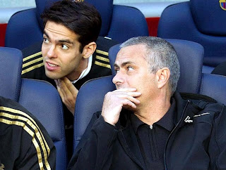 Mourinho with Kaka talking on the bench