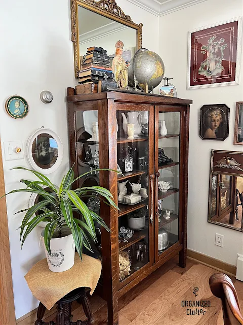 Photo of a living room decorated with family antiques and vintage collections.