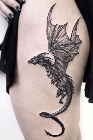 dragon-flying-black-ink-tattoo-on-thigh