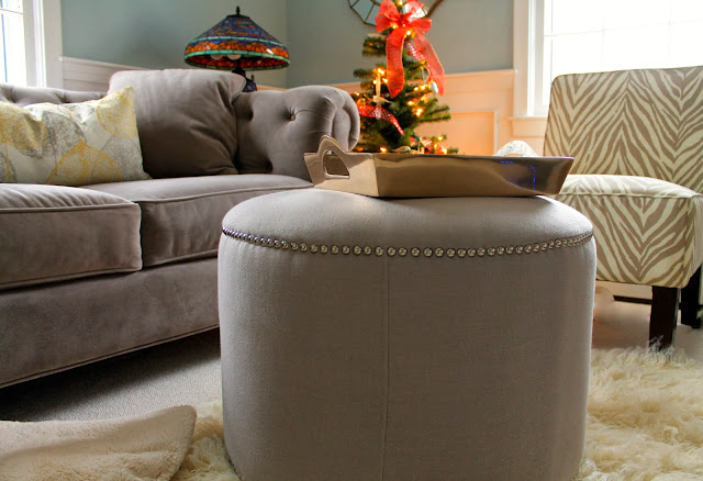 tufted couch, nailhead ottoman, zebra chairs