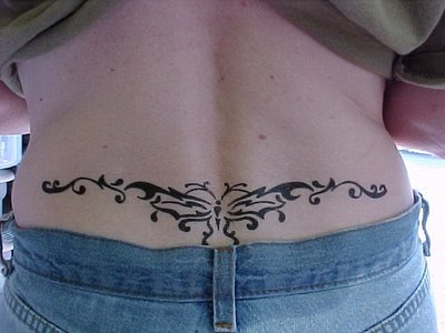 Sexy Girl With Tribal Butterfly Tattoo On The Lower Back