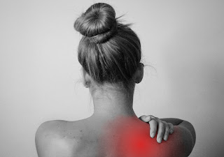 a picture of a woman with a bruise or red spot in the back