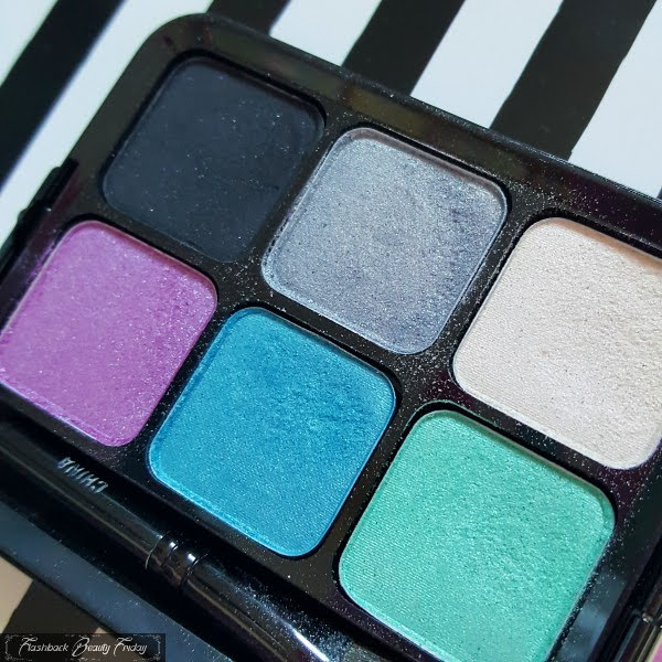 open 6 pan eyeshadow palette with black, grey, ivory, lilac, blue and green colours