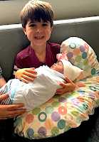 Alex Romero with newborn sister