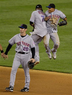 Reyes and Gomez are excited after beating the Yankees in Yankee Stadium on June 15