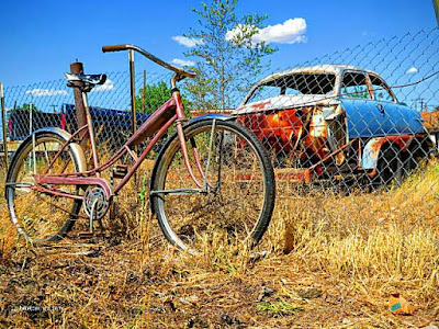 Picture of desert weathered antique bike and car in New Mexico