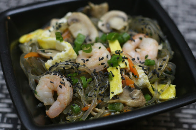 The Finished Japchae topped with shrimp, eggs, green onions, carrots