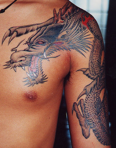 Dragon Tattoo Chest Art very beefy man with dragon tattoo in chest look so