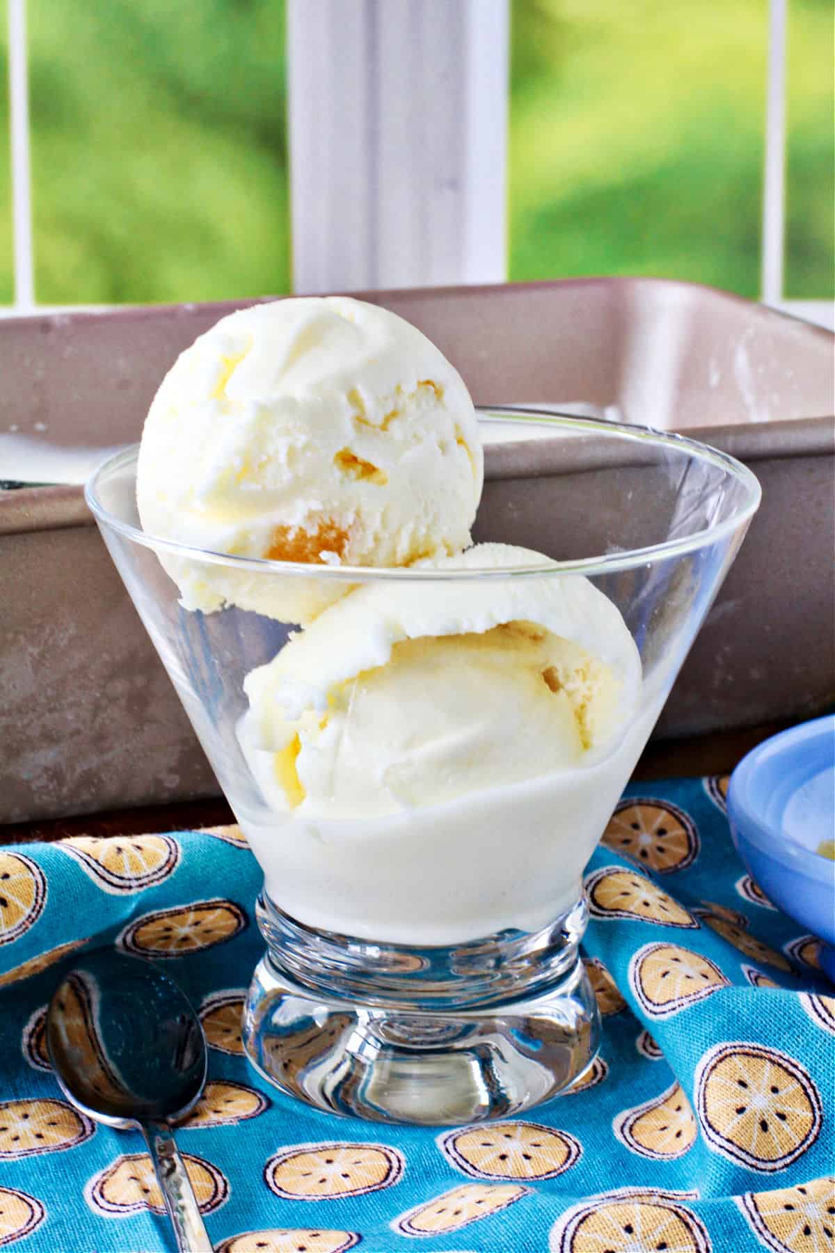 Lemon Ginger Ice Cream in a glass with the rest in a bread pan.