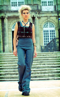 blue overalls and cropped sleeveless jacket French fashion designer