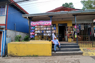 man on stair in front of shoe store in Puriscal