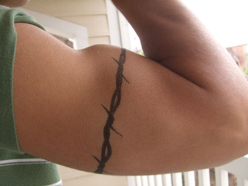 Tattoos men should never get like barbed wire around the arm