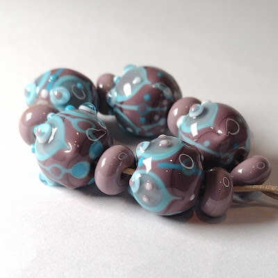 Purple and turquiose lampwork beads by Jolene Wolfe