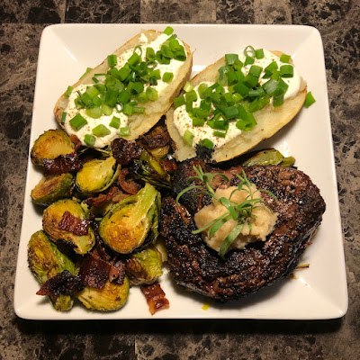 Rare grilled prime ribcap, grilled leeks, bacon roasted Brussels sprouts and a big baked potato