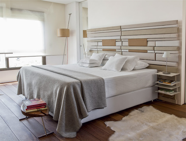 Modern bed in the bedroom of small duplex apartment 