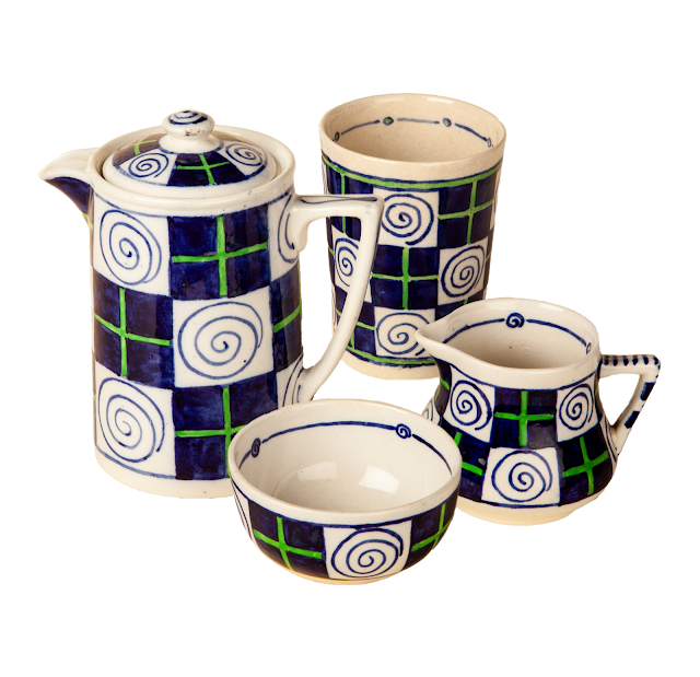 Matching coffee pot, milk jug, beaker and sugar dishes in blue, green and white painted ceramic