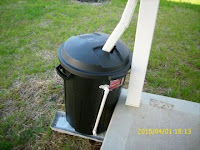 rain barrel from a trash can