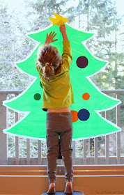 Sticky Kid-Sized Christmas Tree with reusable ornaments - you can decorate all season long!  From Fun at Home with Kids