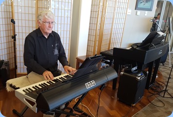 Gordon Sutherland playing his Korg Pa4X using a Samsung Tablet with the score music.