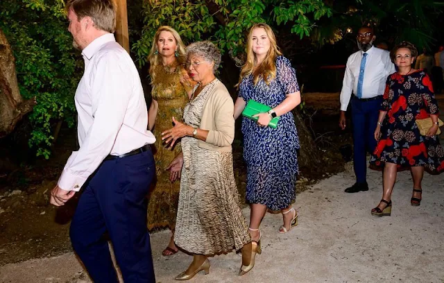 Queen Maxima in Zimmermann mustard floral tropicale crinkle dress. Princess Amalia in LaDress Naomi chiffon crepe maxi dress