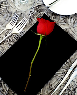 Black napkin and red rose table setting - Photo by Patricia Stimac, Seattle Wedding Officiant