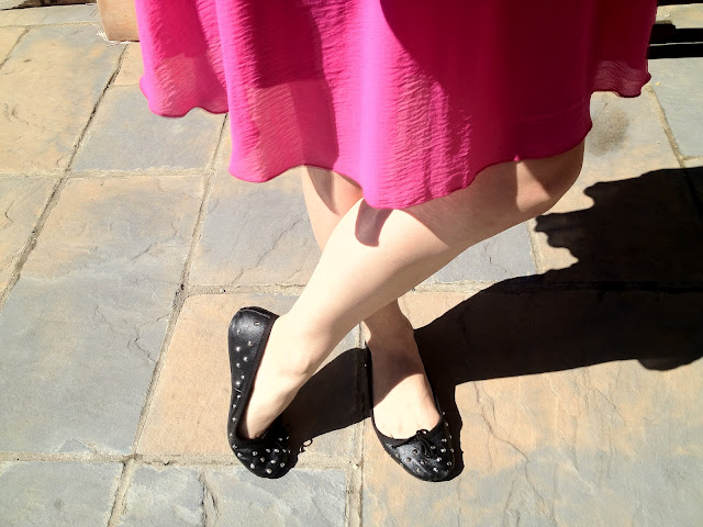 Person wearing black pumps