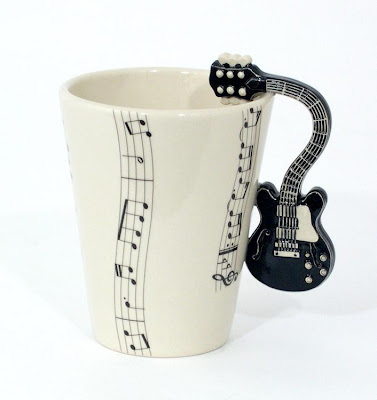 Coffee cup design with guitar