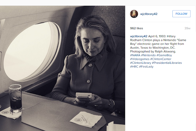 Hillary Clinton plays Nintendo Game Boy on airplane