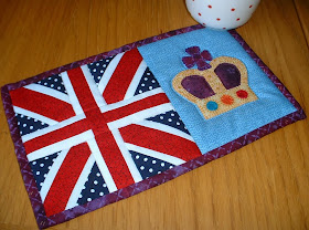 http://www.craftsy.com/pattern/quilting/home-decor/union-jack-mug-rug/51744