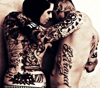This is an incredible photo of a couple that are tattooed, and it really